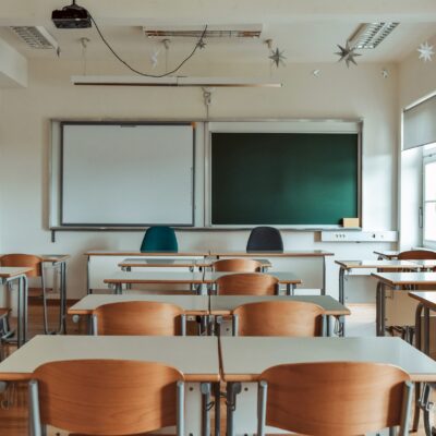 empty-school-classroom-with-green-chalkboard-2023-11-27-04-51-47-utc