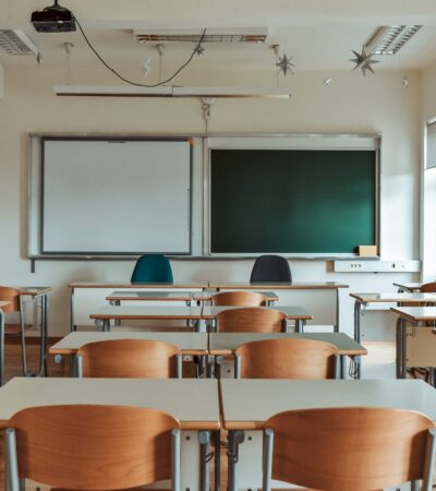 empty-school-classroom-with-green-chalkboard-2023-11-27-04-51-47-utc